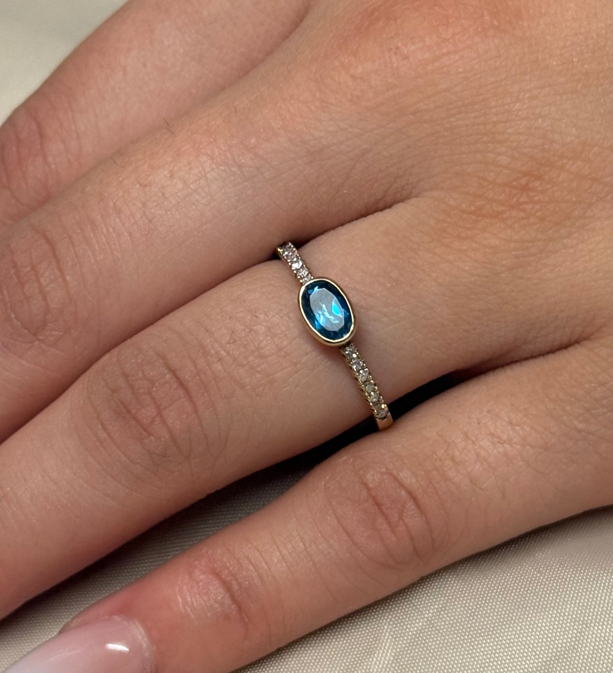 9K Yellow Gold East West Oval London Blue Topaz with Diamond Band
