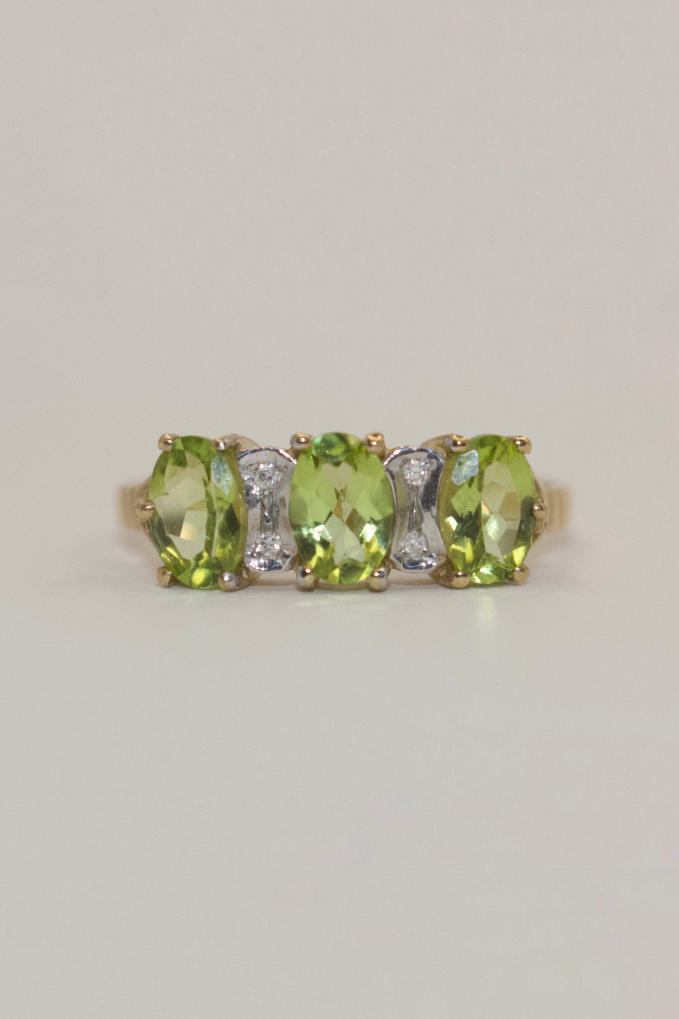 9K Yellow Gold Three Stone Peridot with Diamond Accents