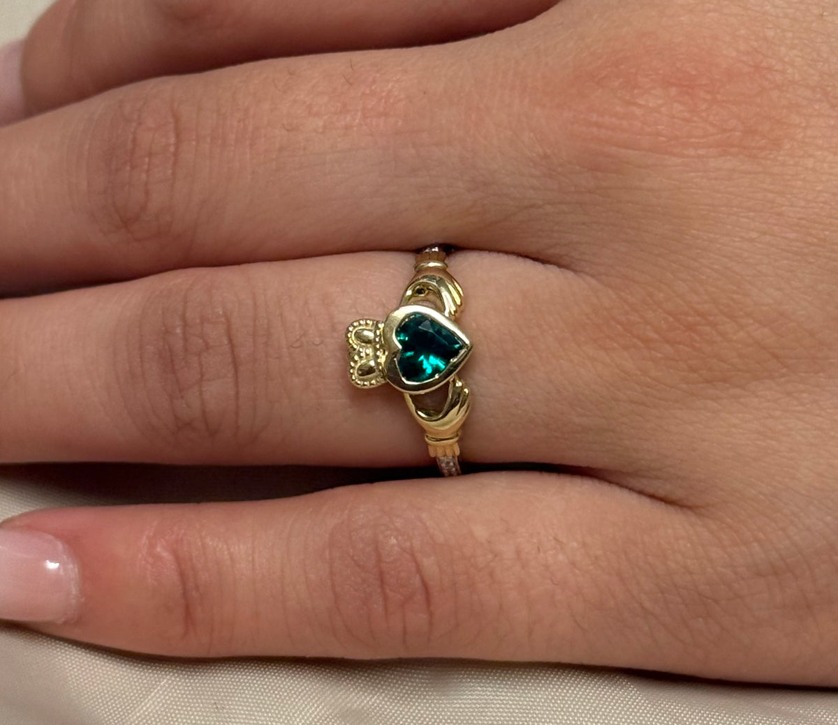 9K Yellow Gold Bezel Set Laboratory Grown Emerald Claddagh with Diamond Shoulders