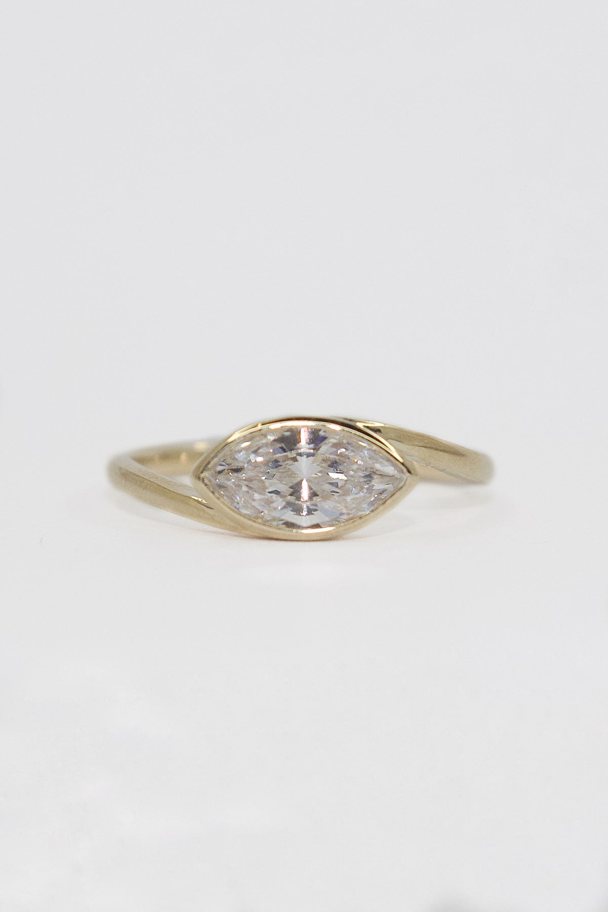 9K Yellow Gold East West Bezel Set Marquise CZ Ring
