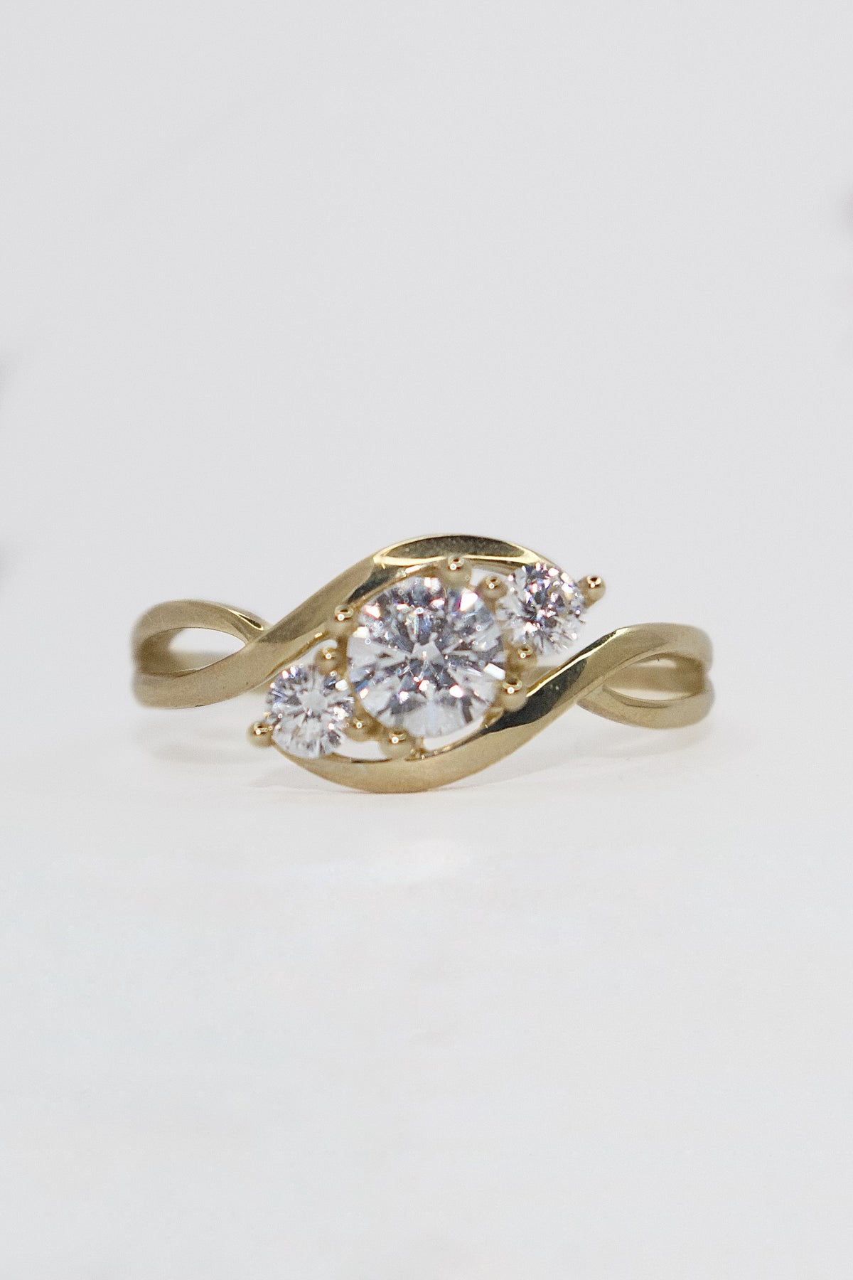 9K Yellow Gold Cz Three Stone Crossover Ring