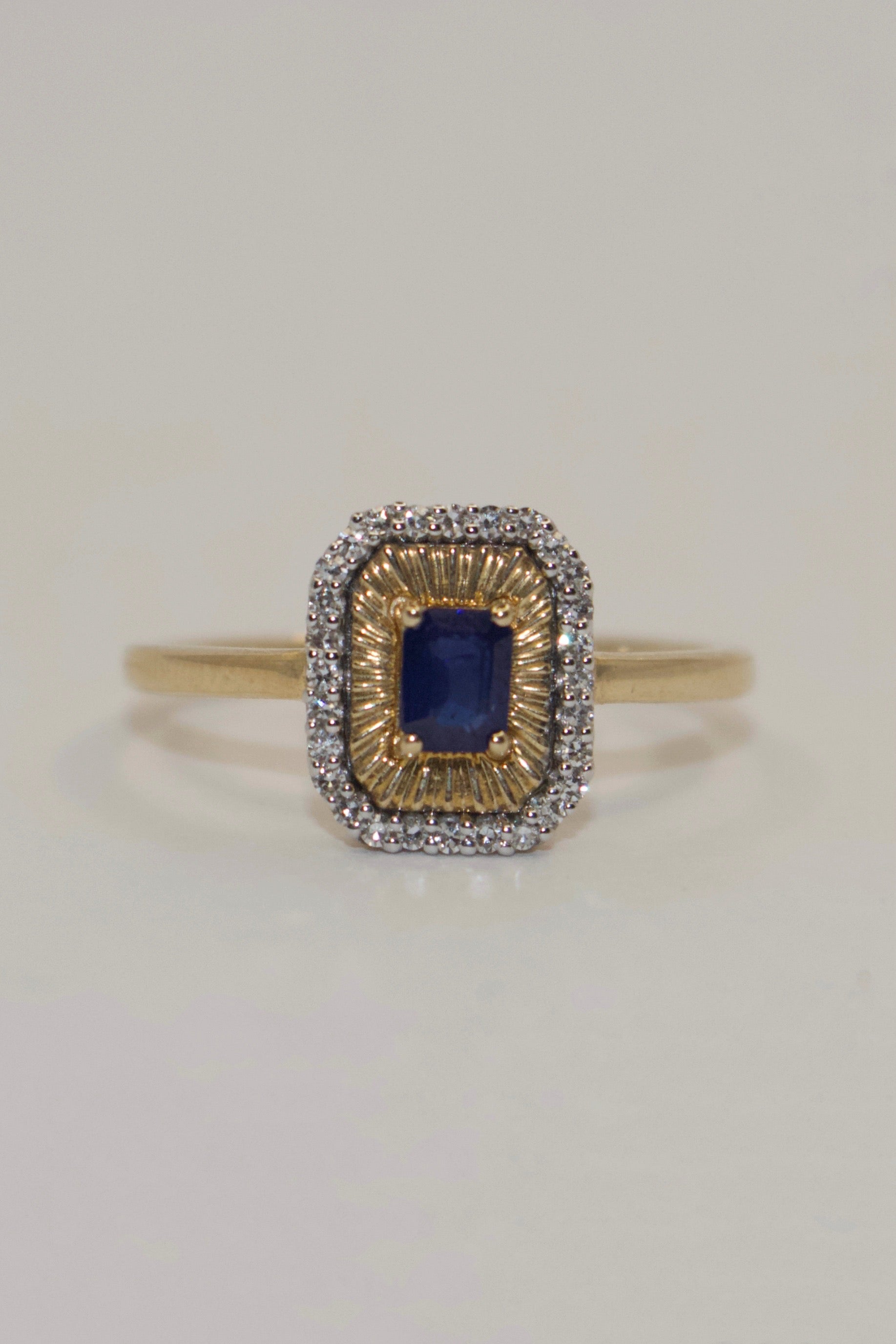 9K Yellow Gold Emerald Cut Sapphire with Diamond Halo