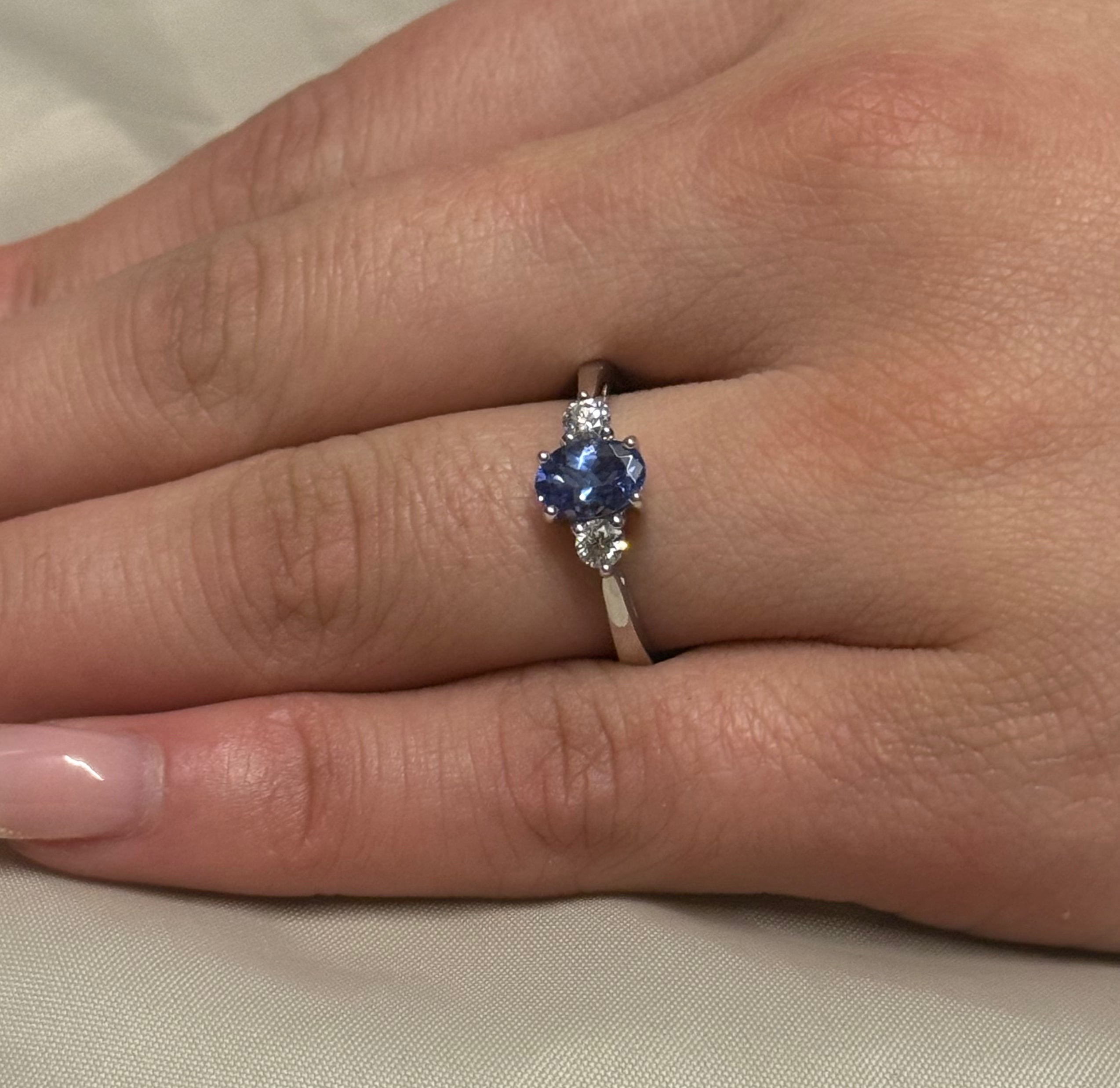 18K White Gold Oval Tanzanite with Round Diamond Side Stones
